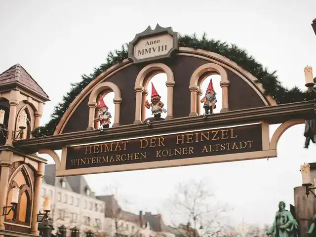 Entrance arch of Heinzels Wintermärchen, the Christmas market in Cologne's old town, with gnome figures