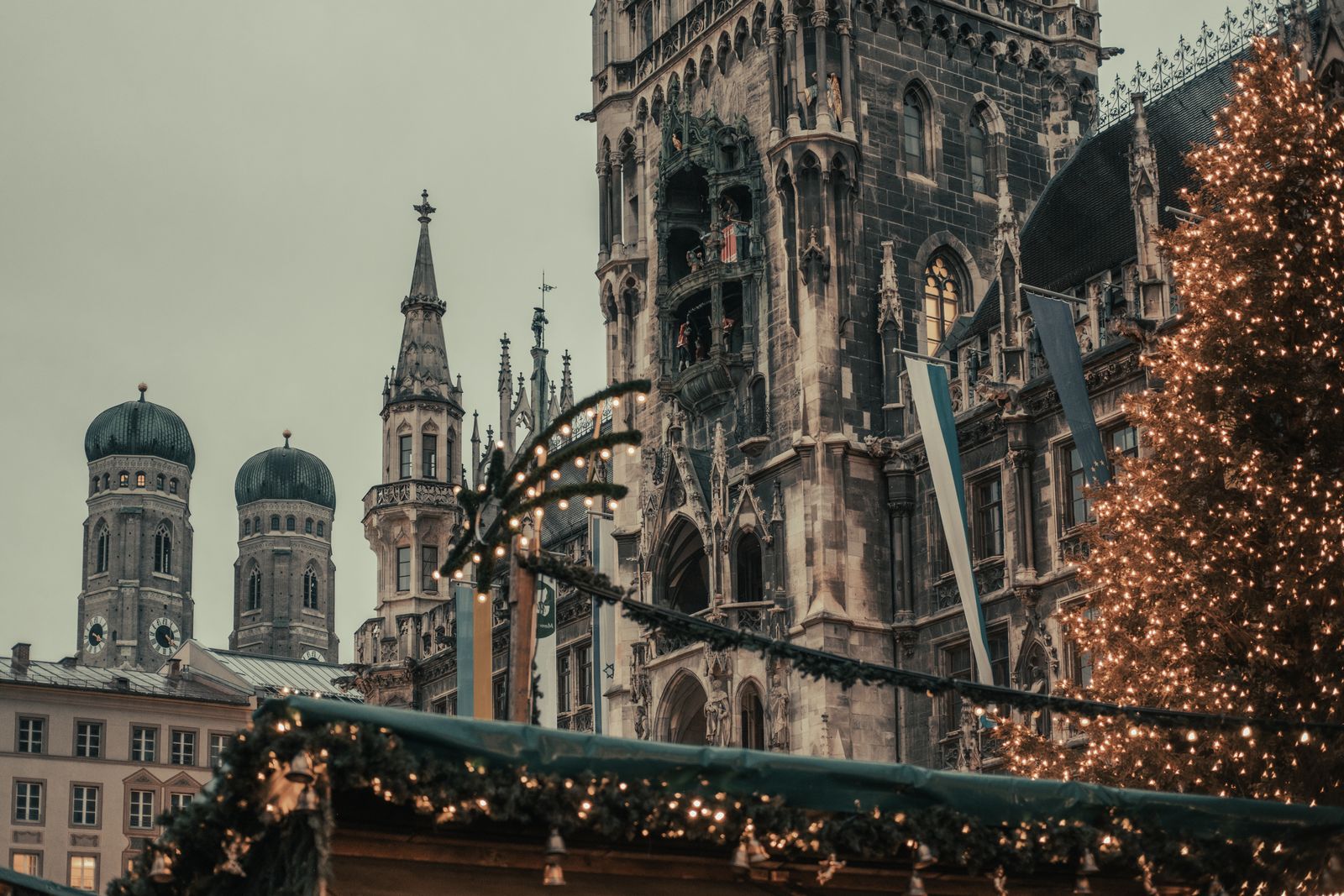 Christmas market stalls and a decorated tree in front of Munich's New Town Hall on Marienplatz